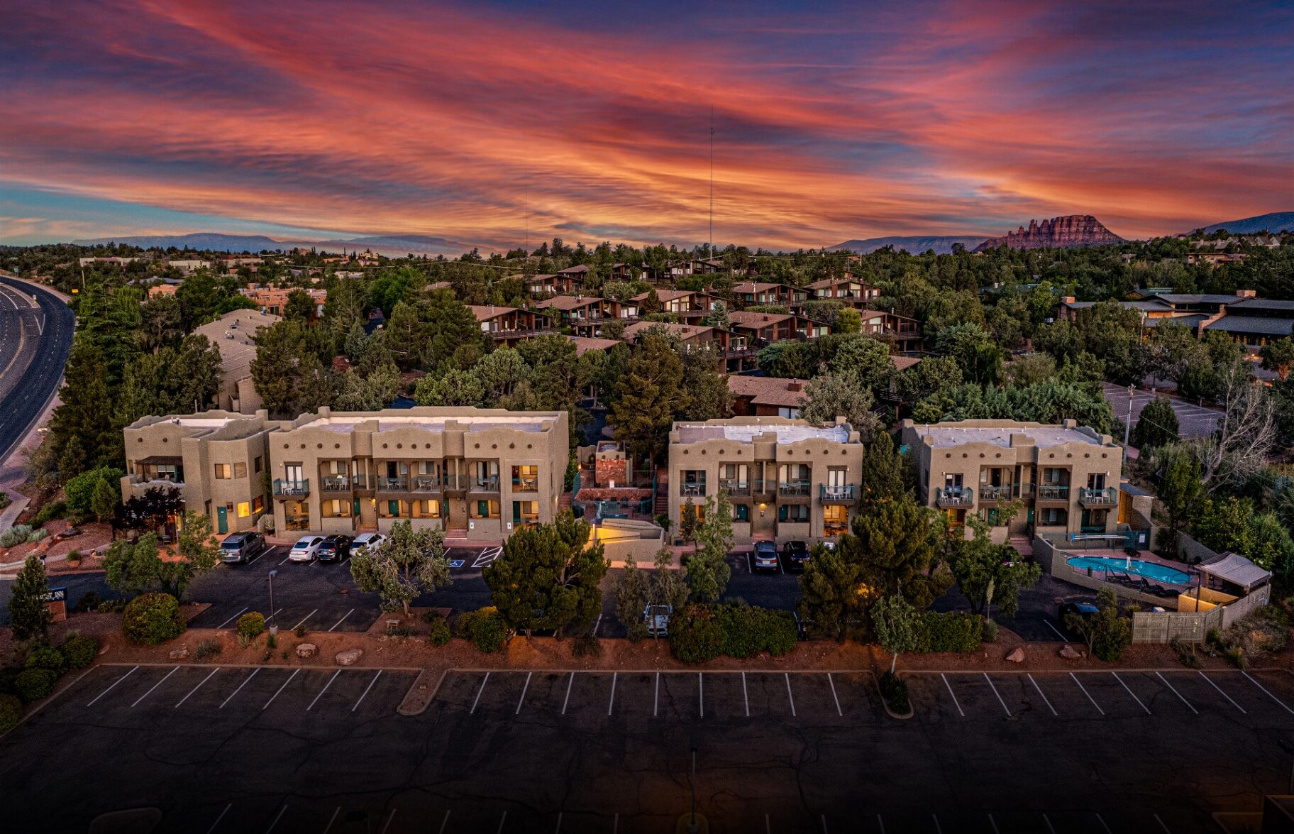 Southwest Inn at Sedona exterior at golden hour, adobe architecture with desert landscaping